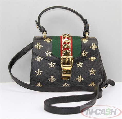 black gold bee and stars gucci bag|Gucci bee accessories.